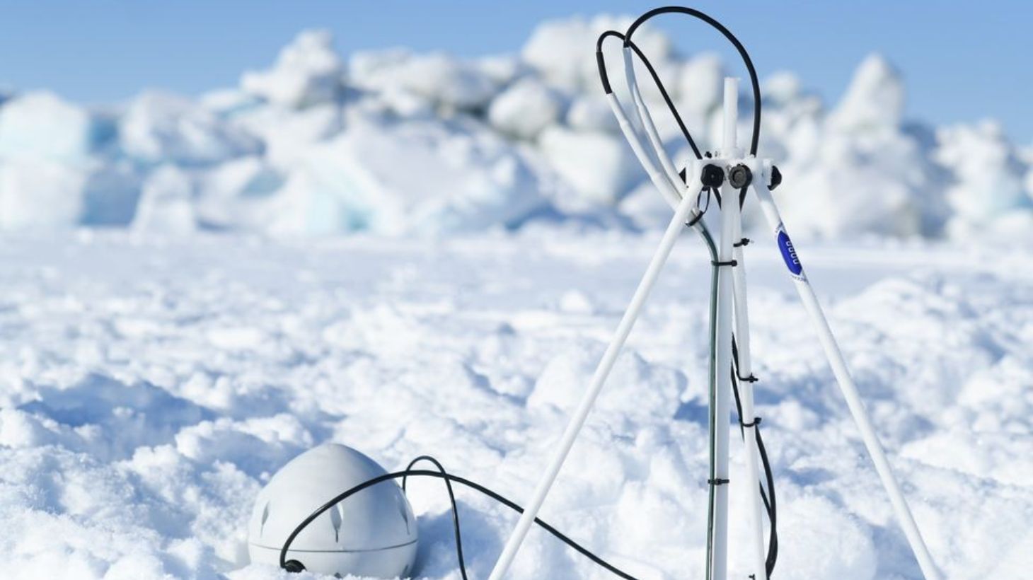 Two white probes sit in the snow.