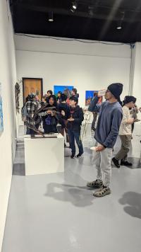 Image of students looking at artworks