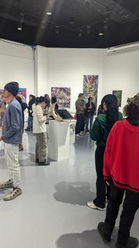 Students looking at artworks