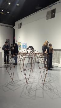Image of students looking at artworks