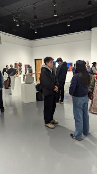 Image of students looking at artworks