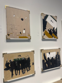 Picture of artworks hanging on the wall, depicting a classroom