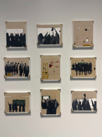 Picture of artworks hanging on the wall, depicting a classroom