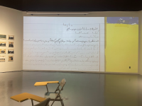 Picture of a projected artwork on the wall, depicting a notebook