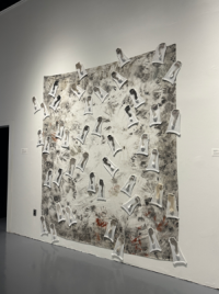 canvas with taped papers that have footprints
