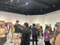 Picture of people looking at artworks