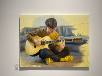 Painting of a guy wearing glasses sitting on the ground with an acoustic guitar in his hands