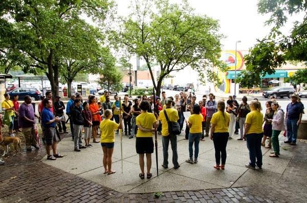 Bilingual guides prepare the audience prior to the performance. Ronit Eisenbach and Sharon Mansur, Placeholders, 2014. (Photograph by Zachary Z. Handler, copyright Eisenbach and Mansur)